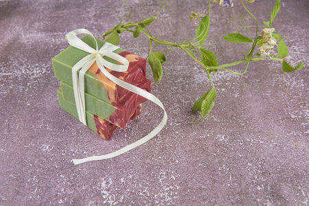 Colorful handmade soap concept. Natural handmade soap on a gray background.Handmade natural eco soap, selective focus. Copy of the space, top view, background mode. Healthy skin. Wash their hands.の写真素材