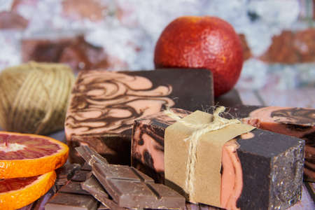 Natural handmade soap with chocolate and orange on a wooden countertop. Healthy lifestyle, eco-friendly products.の写真素材