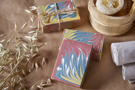 Fragrant multicolored organic handmade soap and personal care items made of natural materials on a brown background ..の写真素材
