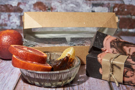 Natural handmade soap with chocolate and orange on a wooden countertop. Healthy lifestyle, eco-friendly products.の写真素材