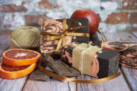 Natural handmade soap with chocolate and orange on a wooden countertop. Healthy lifestyle, eco-friendly products.の写真素材