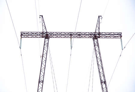 A high-voltage power line against a cloudy sky. Power line pillars.の写真素材