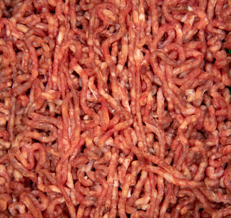 Full frame fresh raw minced meat as a backdrop.の写真素材