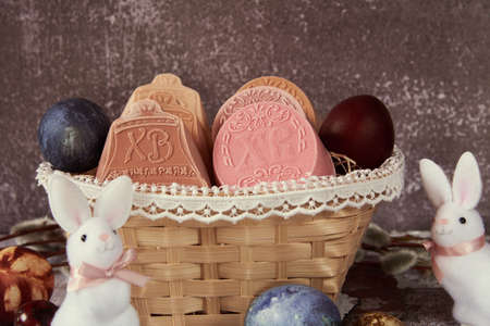 Delicate handmade Easter soap in a wicker basket and a variety of Easter decor.の写真素材