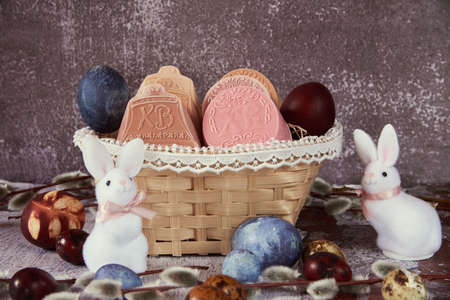 Delicate handmade Easter soap in a wicker basket and a variety of Easter decor.の写真素材