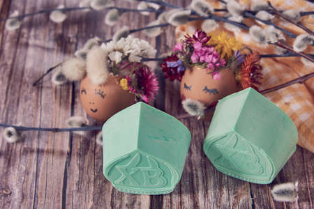 Bright handmade Easter soap and Easter holiday decor on wooden background.の写真素材