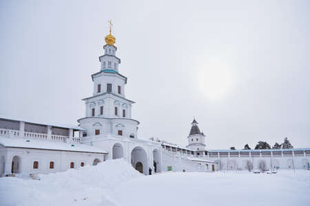 Russia, Istra, New Jerusalem Monastery, February 2021. A white elegant church against a cloudy gray sky.の写真素材