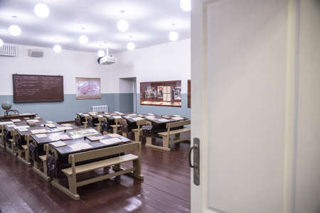 Museum of Zoya Kosmodemyanskaya. New Zoya exhibition complex in Petrishchevo, Moscow region, Russia. October 2021. School class. Antique desks with textbooks and notebooks.のeditorial素材