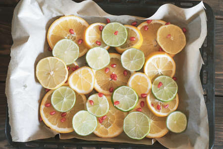 A full frame of citrus fruits, cut into slices. Food background. Focus on citrus fruits.の写真素材