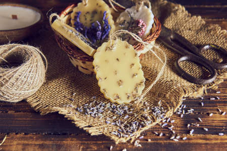 Fragrant handmade sachets made of beeswax, decorated with dried flowers in the interior.の写真素材