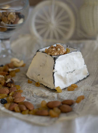 Various types of cheese with white mold on packaging paper. Home production, natural products.の写真素材