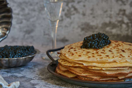 pancake week. Pancakes with black caviar. food background.の写真素材