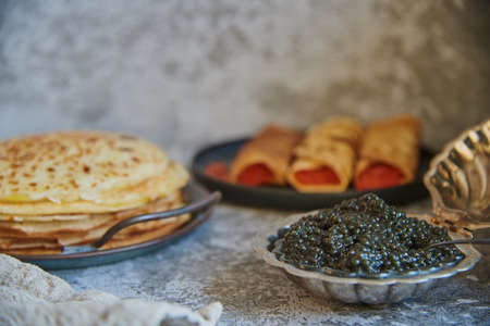pancake week. Pancakes with red and black caviar. food background.の写真素材