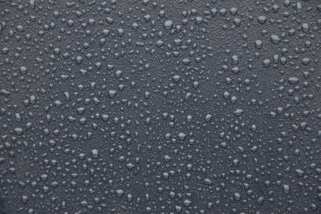 Full frame of a water drop on a dark background. abstract texture. Copy space design.の写真素材