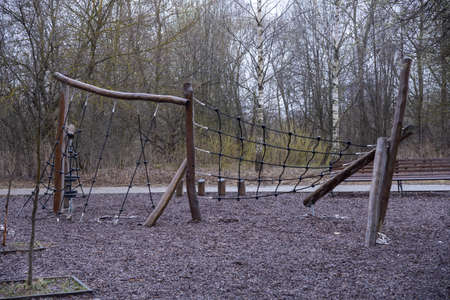 A sports field with a climbing net in a cloudy rainy public park.の写真素材