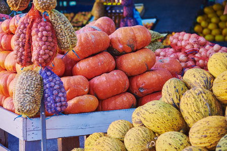 Vegetable roadside fair, autumn harvest of pumpkins, watermelons, nuts, etc. Selective focus.の写真素材