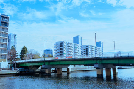Cityscape with bridge over the river and modern buildings on the backgroundの写真素材