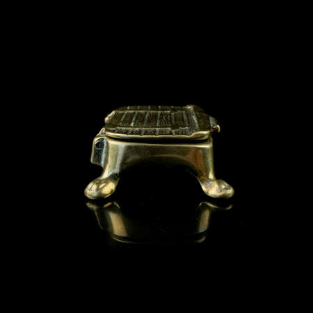 copper jewelry antique box. vintage gold jewelry box on black isolated backgroundの写真素材