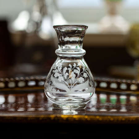 summer still life with a bouquet. antique transparent glass vase with a bouquet of flowers in the interior. crystal vase with a summer bouquet.の写真素材