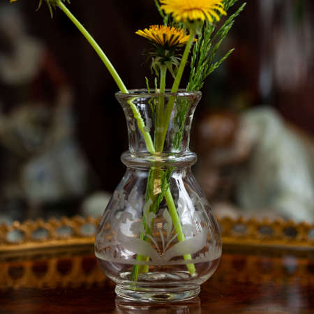 transparent antique glass vase in luxury interior. crystal vase engraving. glass close-upの写真素材