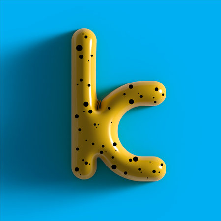 3d yellow bubble plastic letter K. Glossy yellow alphabet letter K lowercase. 3d render realistic yellow plastic bubble on Blue background letter Kの写真素材