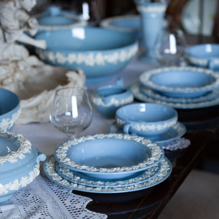 Antique British blue porcelain tea set.wedding table setting is richly decorated in luxurious interior. china vintage serviceの写真素材