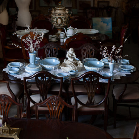 Antique British blue porcelain tea set.wedding table setting is richly decorated in luxurious interior. china vintage serviceの写真素材