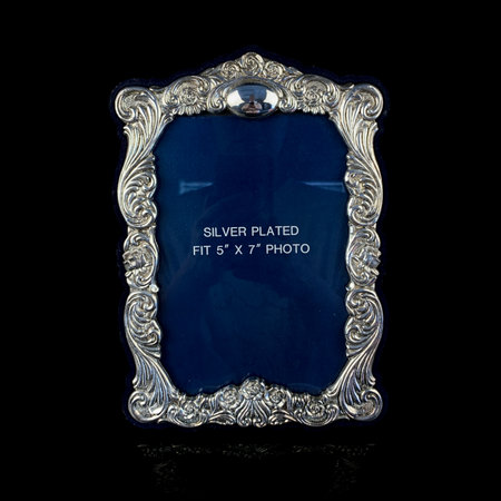Blue picture frame isolated on a black background. close up image. vintage silver photo frameの写真素材