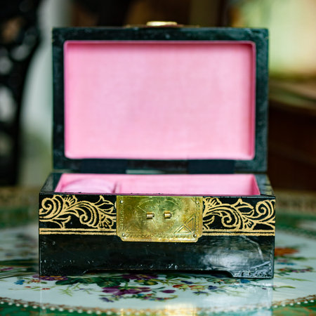 jewelry box with a gold ring in the form of a heart. gold antique boxの写真素材