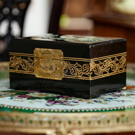 Wooden box for jewelry on the table in the interior of the room. gold antique boxの写真素材