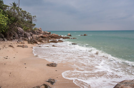 Tropical beach at cloudy and stomy weather in Koh Phangan, Thailandの写真素材
