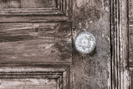An old vintage wooden door and iron knobの写真素材