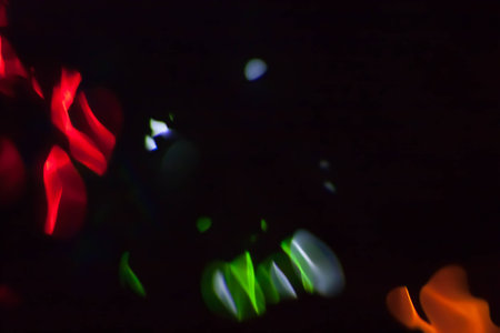 Abstract blurred colorful light on black backgrpound. Multicolor vivid reflections on the water. Cosmic, space and biological.の写真素材