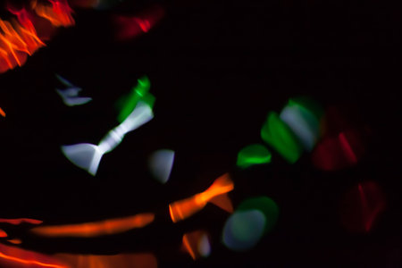 Abstract blurred colorful light on black backgrpound. Multicolor vivid reflections on the water. Cosmic, space and biological.の写真素材