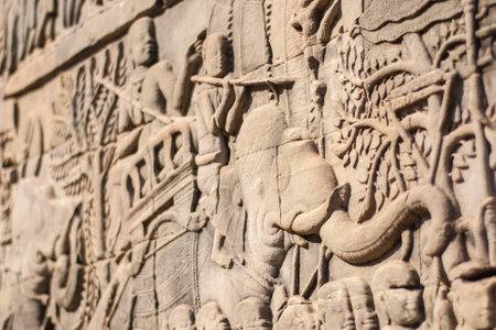 Angkor Wat. Outer gallery of Bayon showing a series of bas-relief depicting historical events and daily lives of Angkorian of that time. This carvings showing battles between probably Khmer and Cham.の写真素材