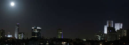 Tel Aviv at night, Full moon over Tel Aviv's skyline, Israel.の写真素材