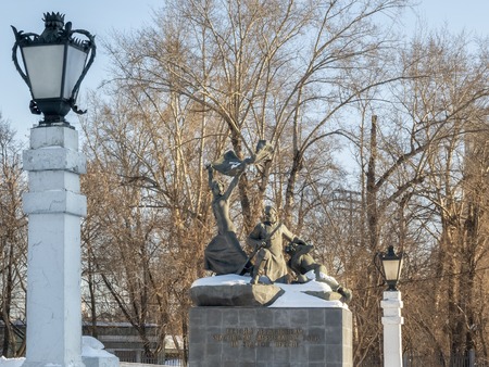 The memorial to the participants of the battles at Krasnoy Presnya in Moscow. Inscription on pedestal is Heroes of a warrior, participants of barricade battles in Krasnaya Presnya . Winter sunny dayの写真素材