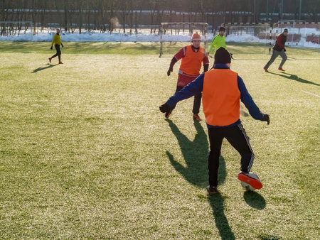 Moscow, Russia - March 16, 2018: amateur football game on the street in Moscow. Adults play soccer outdoors on a small pitchのeditorial素材