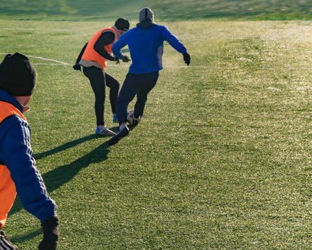 Moscow, Russia - March 16, 2018: amateur football game on the street in Moscow. Adults play soccer outdoors on a small pitch. Horizontalのeditorial素材