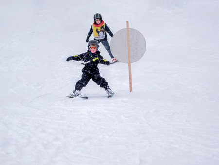 Zams, Austria - 22 Februar 2015: Children in ski school. Ski resort Landeck. Children learn to skiのeditorial素材