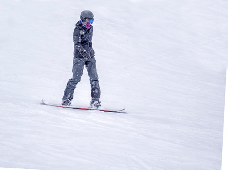 Zams, Austria - 22 Februar 2015: Ski resort. Skateboarder rides from mountainのeditorial素材