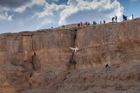 Quadcopter, drone, copter makes photo climbers people. Modern video and aerial photographyの写真素材