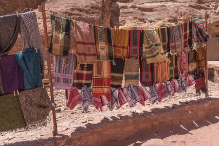 Colorful head scarves and arabic fabric. Products, souvenirs for tourists in Petra, Jordan