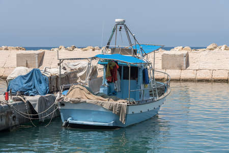 Blue small fishing boat in the bay of the Mediterranean Sea. Port haifa israelの写真素材