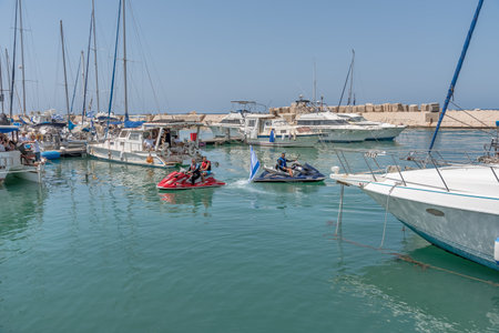 Haifa, Israel - April 19, 2018: Men on the water scooters in the bay of the Mediterranean Seaのeditorial素材
