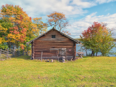 Kizhi, Russia - September 19, 2021: Autumn landscape. Wooden house on the shores of Lake Onega on the Kizhi islandのeditorial素材
