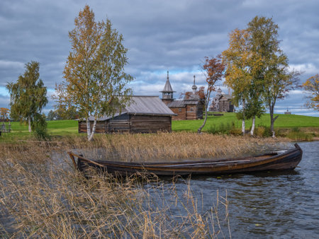 Kizhi, Russia - September 19, 2021: Lake Onega and boats by the Kizhi island. Autumn village landscapeのeditorial素材