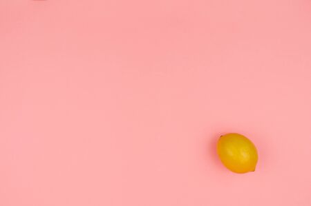 Lemon on a pink background.  Still life with citrus. Autumn Festival.の写真素材