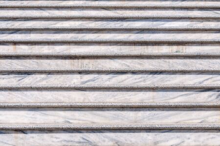 Marble steps. The rhythm of the stairs. Descent and ascent. A natural stone.の写真素材