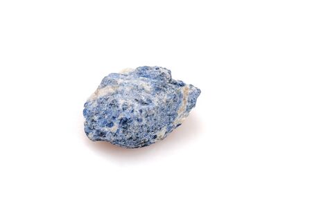 Natural stone sodalite on a white background. Blue nugget. Gemology.の写真素材